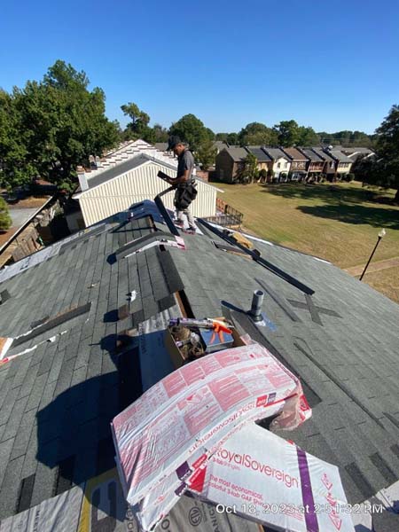 Roof replacement in progress with new shingles being installed